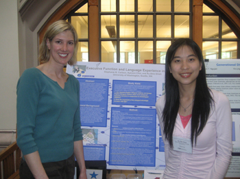 Two graduate students with a poster