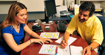 Student getting academic advising from teacher