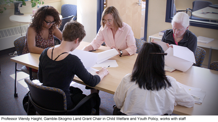 Professor Wendy Haight, Gamble-Skogmo Land Grant Chair in Child Welfare and Youth Policy, works with staff