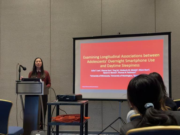 Celia T. Lee presenting her research in a paper session at the 2025 NCFR conference.
