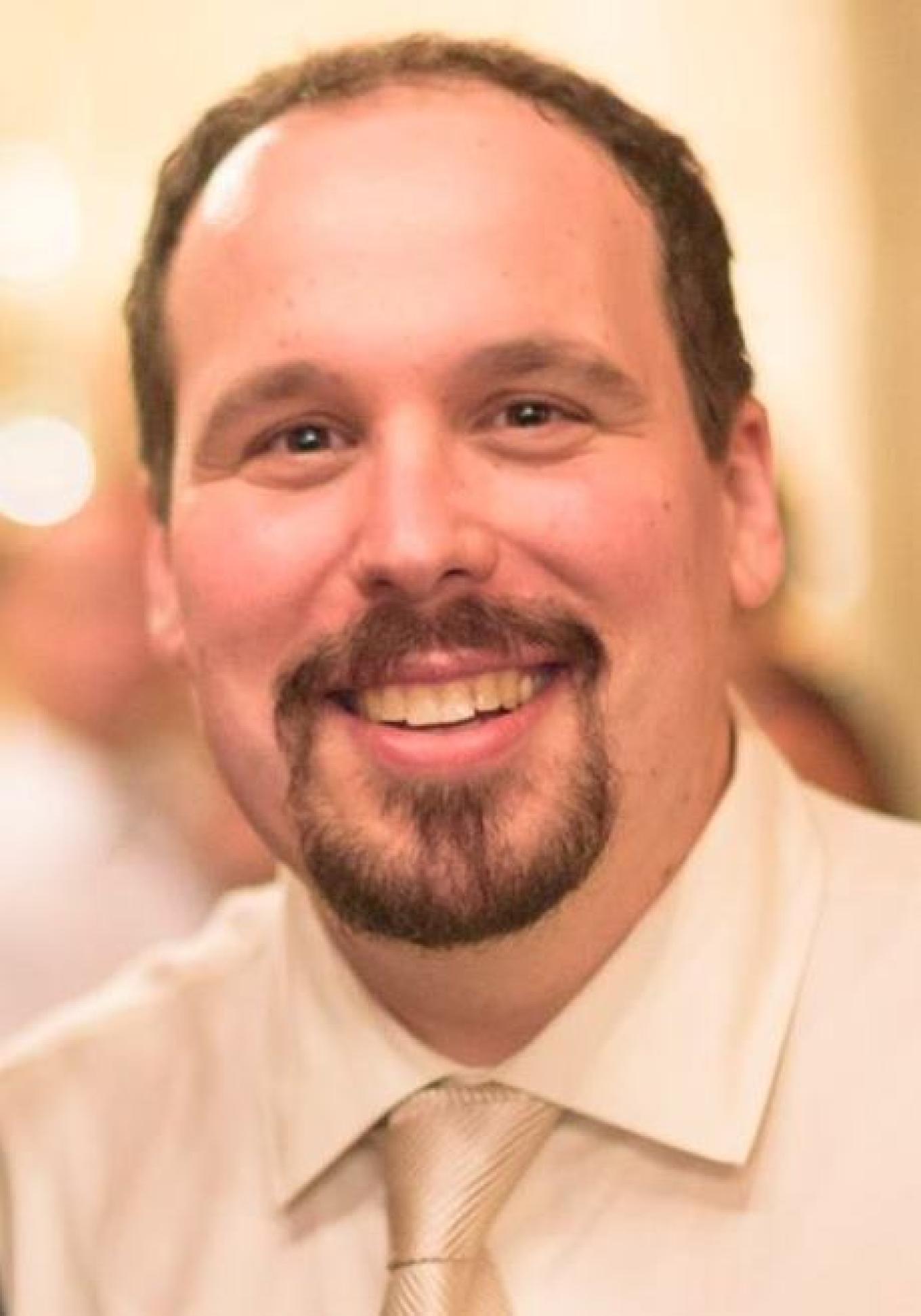 Headshot of Dr. Glenn I. Roisman.